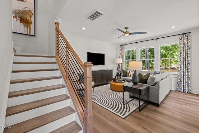 4611 Mint Leaf Ln, Raleigh, NC 27612 - living area with wood finished floors, stairs, recessed lighting, and a ceiling fan
