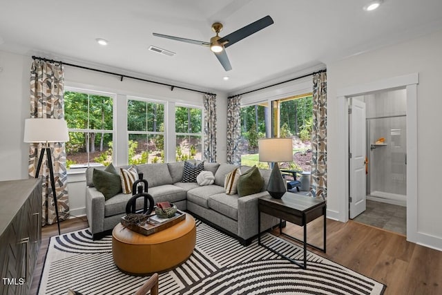 4611 Mint Leaf Ln, Raleigh, NC 27612 - living area featuring a ceiling fan, wood finished floors, and recessed lighting