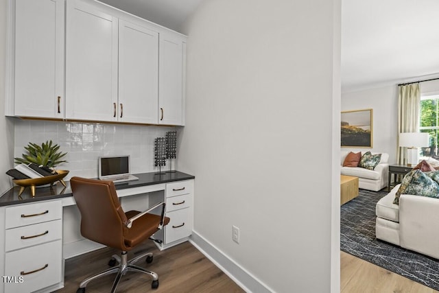4611 Mint Leaf Ln, Raleigh, NC 27612 - home office with wood finished floors and built in desk