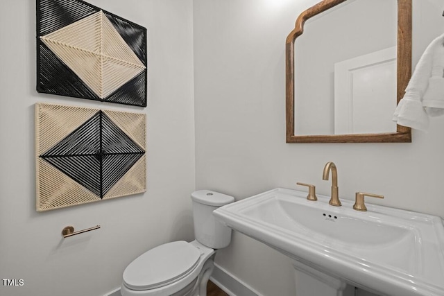 4611 Mint Leaf Ln, Raleigh, NC 27612 - half bathroom featuring a sink and toilet