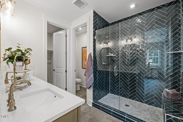 4611 Mint Leaf Ln, Raleigh, NC 27612 - bathroom with double vanity, a shower stall, and recessed lighting