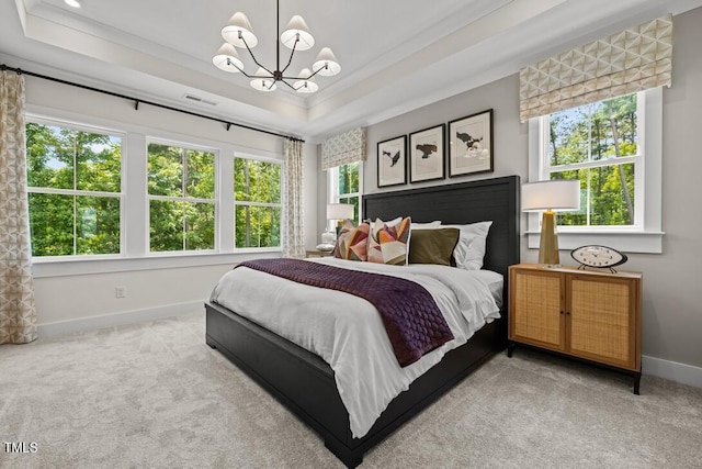 4611 Mint Leaf Ln, Raleigh, NC 27612 - carpeted bedroom with a tray ceiling, a chandelier, and crown molding