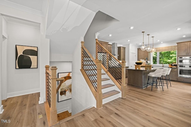 4611 Mint Leaf Ln, Raleigh, NC 27612 - stairs with wood finished floors and recessed lighting