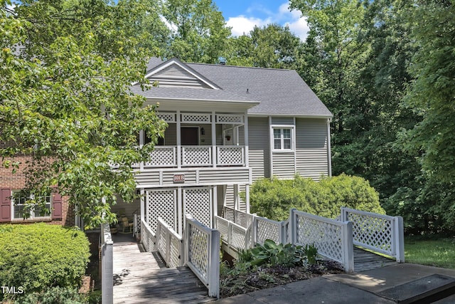view of front of home featuring roof with shingles