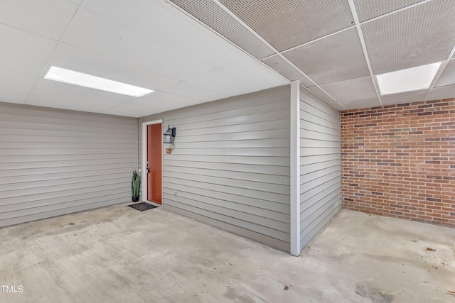 view of exterior entry with brick siding