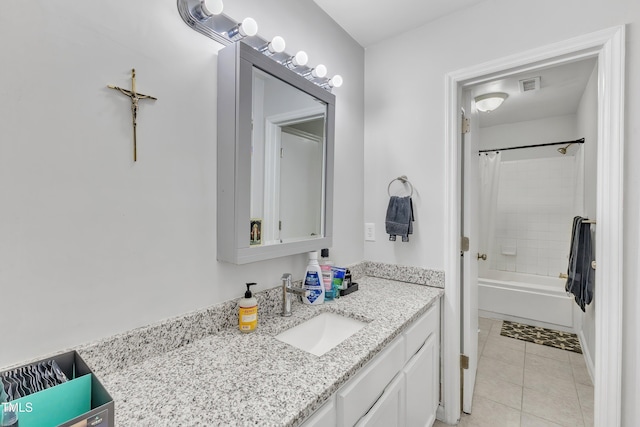 bathroom featuring vanity, tile patterned floors, and shower / bath combo with shower curtain