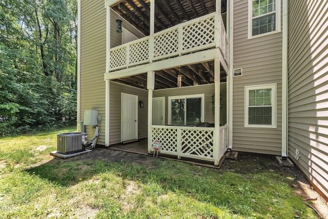 back of property with central AC