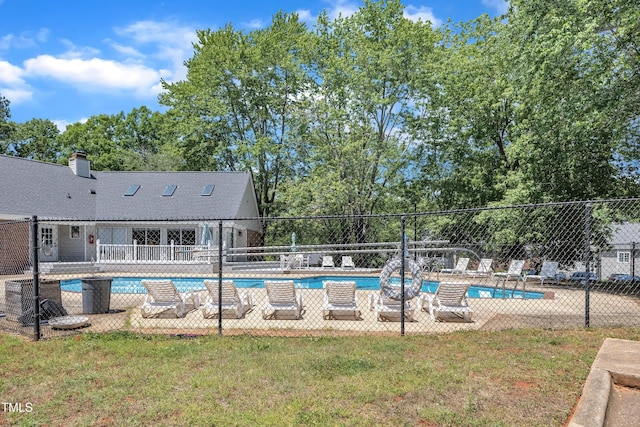 community pool featuring a patio area