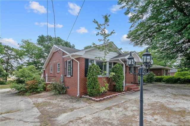 view of side of property with brick siding
