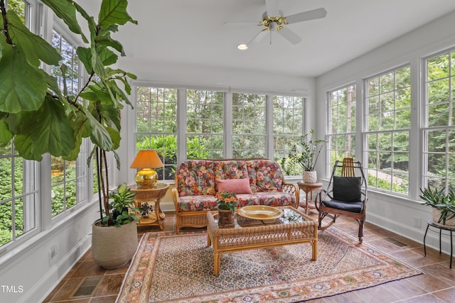 sunroom / solarium with baseboards and recessed lighting