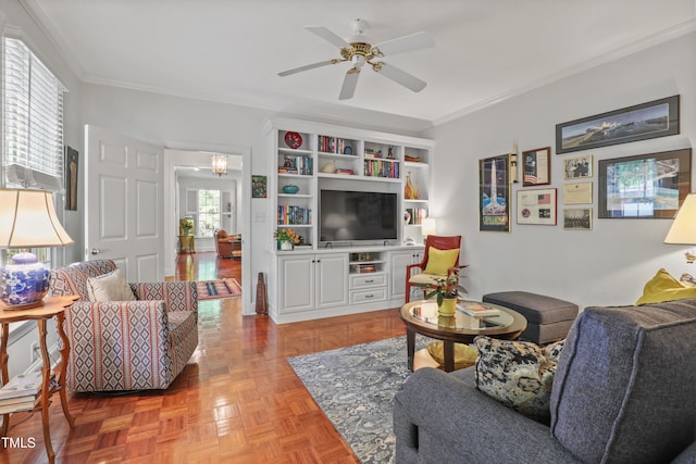 living area with crown molding and ceiling fan