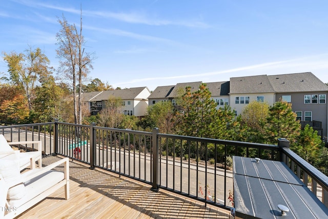 wooden terrace with a residential view