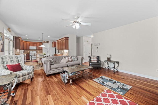 111 Gingergate Dr, Cary, NC 27519 - living room featuring light wood finished floors, a ceiling fan, baseboards, and recessed lighting
