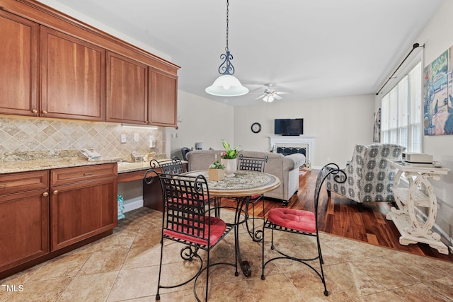 111 Gingergate Dr, Cary, NC 27519 - dining room with a ceiling fan and a fireplace