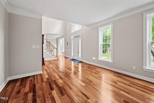 111 Gingergate Dr, Cary, NC 27519 - entrance foyer with ornamental molding, stairway, plenty of natural light, and wood finished floors