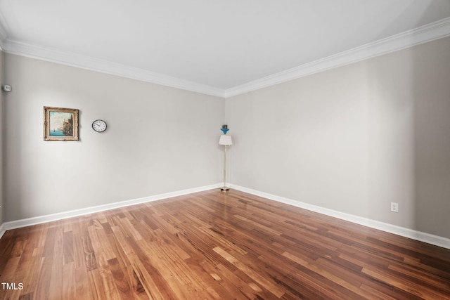 111 Gingergate Dr, Cary, NC 27519 - spare room featuring ornamental molding, baseboards, and wood finished floors