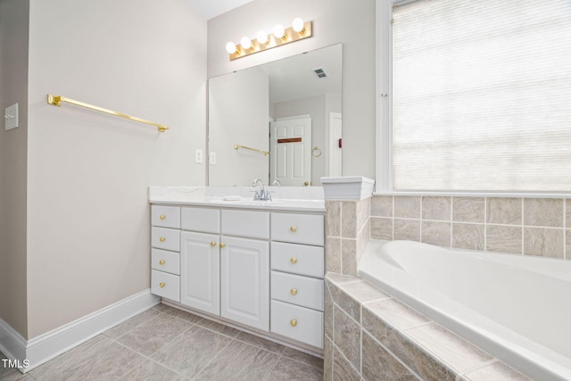 111 Gingergate Dr, Cary, NC 27519 - full bathroom featuring vanity, a bath, baseboards, and tile patterned floors