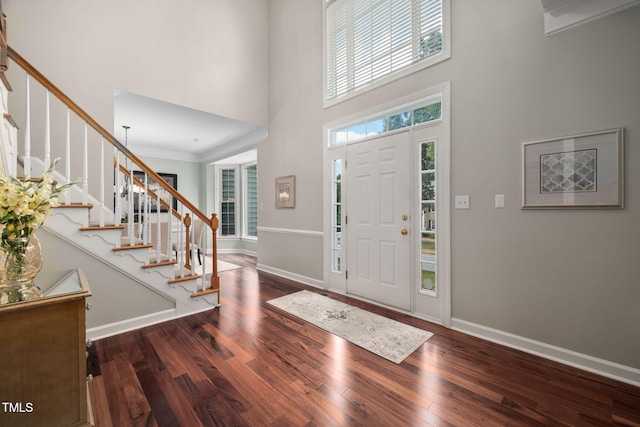 111 Gingergate Dr, Cary, NC 27519 - foyer featuring a high ceiling, wood finished floors, stairway, and crown molding