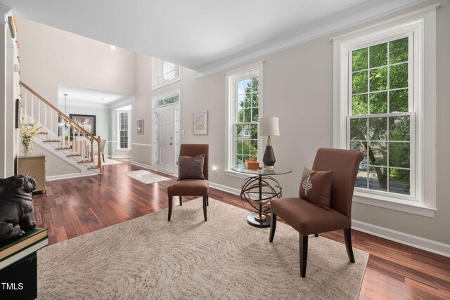 111 Gingergate Dr, Cary, NC 27519 - living area with stairway, crown molding, and wood finished floors