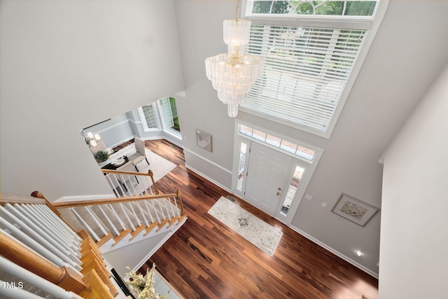111 Gingergate Dr, Cary, NC 27519 - foyer entrance featuring a chandelier, a towering ceiling, wood finished floors, and stairs