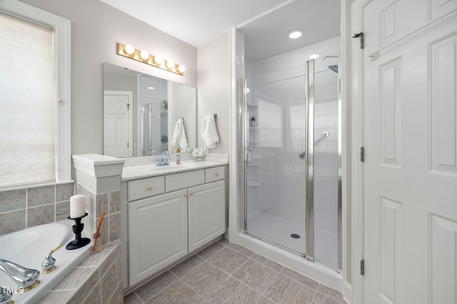 111 Gingergate Dr, Cary, NC 27519 - bathroom with vanity, a stall shower, a bath, and tile patterned floors