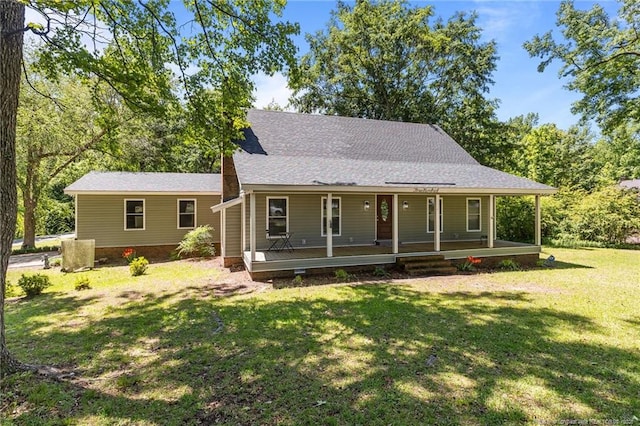 300 Fox Ridge Rd, Warsaw, NC 28398 - view of front of home with covered porch, a front yard, and a shingled roof
