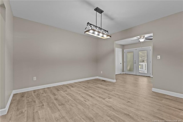 300 Fox Ridge Rd, Warsaw, NC 28398 - unfurnished dining area with baseboards, light wood finished floors, french doors, and a ceiling fan