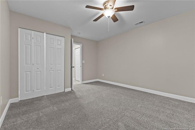 300 Fox Ridge Rd, Warsaw, NC 28398 - unfurnished bedroom with baseboards, carpet floors, a closet, and ceiling fan