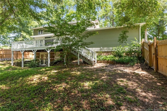 300 Fox Ridge Rd, Warsaw, NC 28398 - rear view of house featuring fence, a wooden deck, and stairway