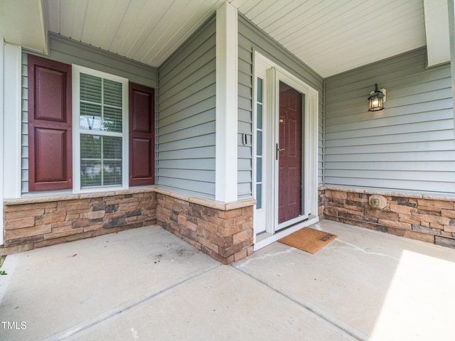 4502 Joe Cotton Dr, Knightdale, NC 27545 - view of exterior entry with covered porch and stone siding