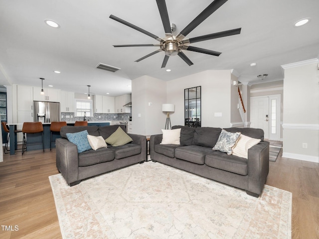 4502 Joe Cotton Dr, Knightdale, NC 27545 - living area featuring a ceiling fan, light wood-style floors, recessed lighting, ornamental molding, and baseboards