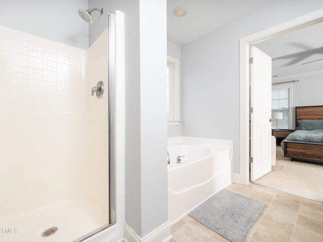 4502 Joe Cotton Dr, Knightdale, NC 27545 - bathroom with ensuite bathroom, a shower stall, a bath, and baseboards