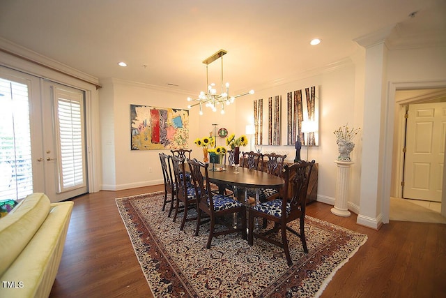 2901 Market Bridge Ln Unit 203, Raleigh, NC 27608 - dining area featuring a chandelier, baseboards, ornamental molding, wood finished floors, and french doors