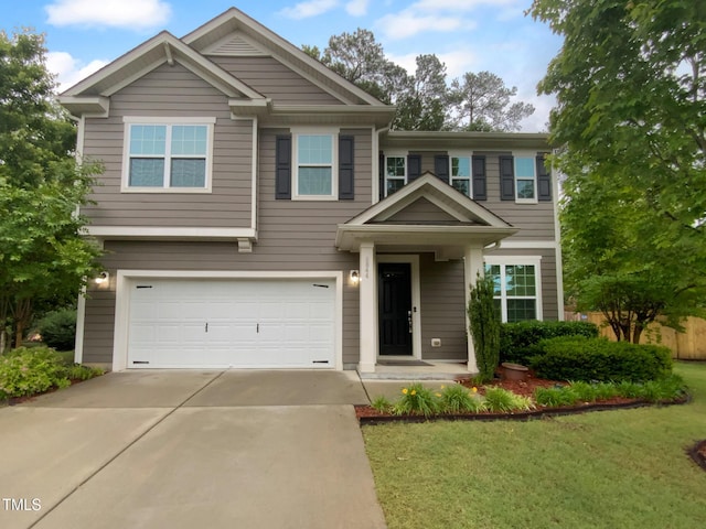 view of front of home featuring a garage and concrete driveway