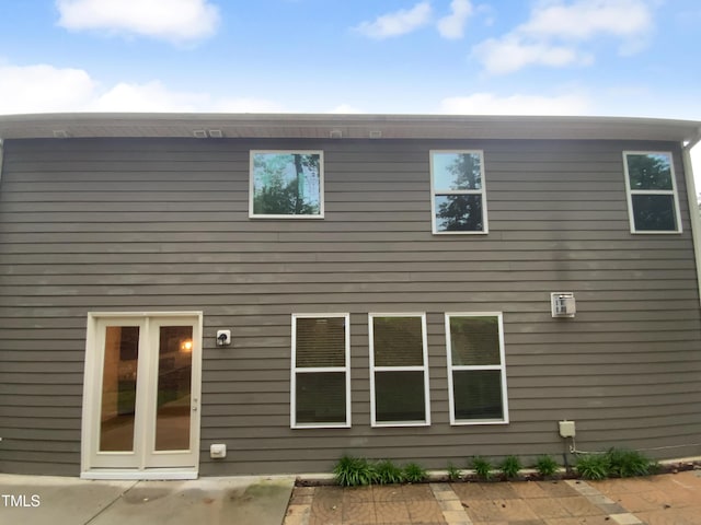 rear view of property featuring a patio area