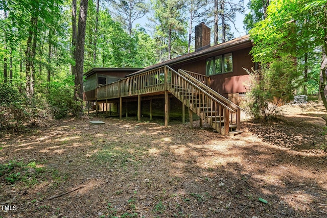 1608 New Hill Olive Chapel Rd, Apex, NC 27502 - rear view of property featuring a chimney, a wooden deck, and stairs