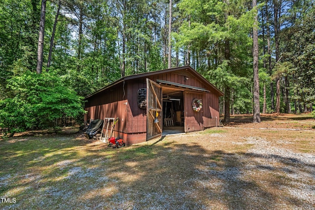 1608 New Hill Olive Chapel Rd, Apex, NC 27502 - view of outdoor structure with an outbuilding and a forest view