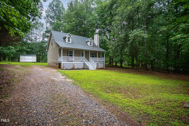 129 Clark Ct, Youngsville, NC 27596 - new england style home with covered porch, driveway, a chimney, crawl space, and a front yard