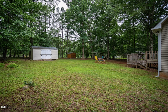 129 Clark Ct, Youngsville, NC 27596 - view of grassy yard with a wooden deck