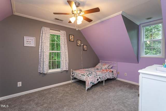 129 Clark Ct, Youngsville, NC 27596 - carpeted bedroom featuring multiple windows, baseboards, vaulted ceiling, a ceiling fan, and ornamental molding