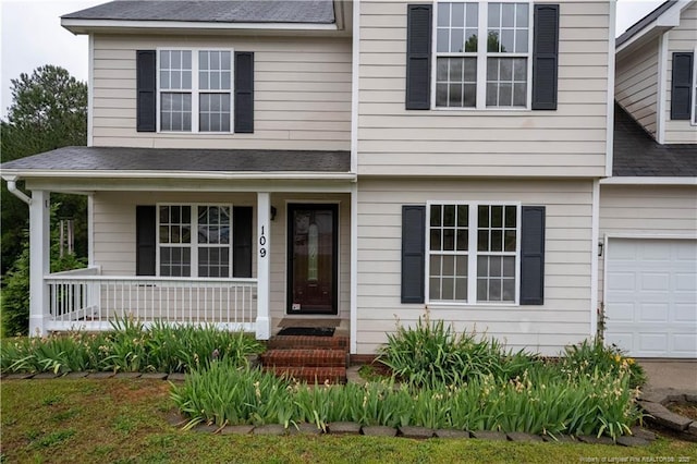 109 Sand Dollar Ct, Raeford, NC 28376 - view of front facade with covered porch, roof with shingles, and an attached garage