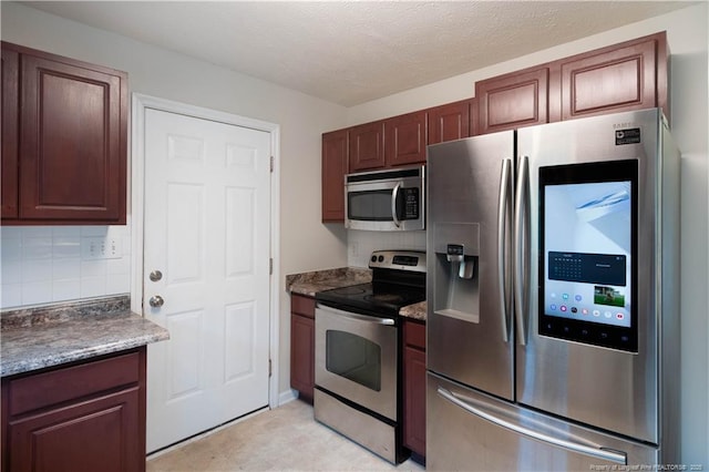 109 Sand Dollar Ct, Raeford, NC 28376 - kitchen featuring stainless steel appliances, tasteful backsplash, and dark countertops