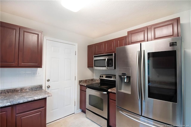 109 Sand Dollar Ct, Raeford, NC 28376 - kitchen featuring stainless steel appliances, decorative backsplash, and dark countertops