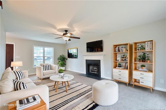 109 Sand Dollar Ct, Raeford, NC 28376 - living room featuring a fireplace with flush hearth, ceiling fan, light colored carpet, and baseboards
