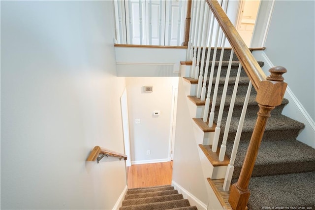 109 Sand Dollar Ct, Raeford, NC 28376 - stairway featuring baseboards and wood finished floors