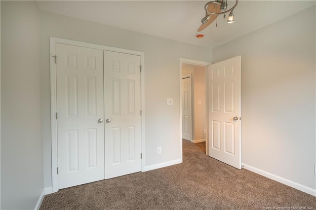 109 Sand Dollar Ct, Raeford, NC 28376 - unfurnished bedroom featuring carpet flooring, a closet, baseboards, and ceiling fan