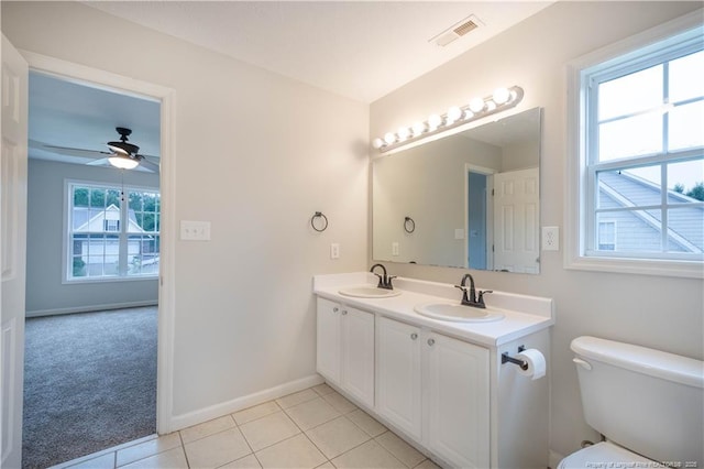 109 Sand Dollar Ct, Raeford, NC 28376 - bathroom with toilet, a ceiling fan, double vanity, baseboards, and tile patterned floors