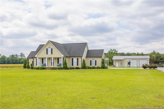 430 Rose Rd, Newton Grove, NC 28366 - view of front of house featuring a front yard, covered porch, an outbuilding, and a detached garage