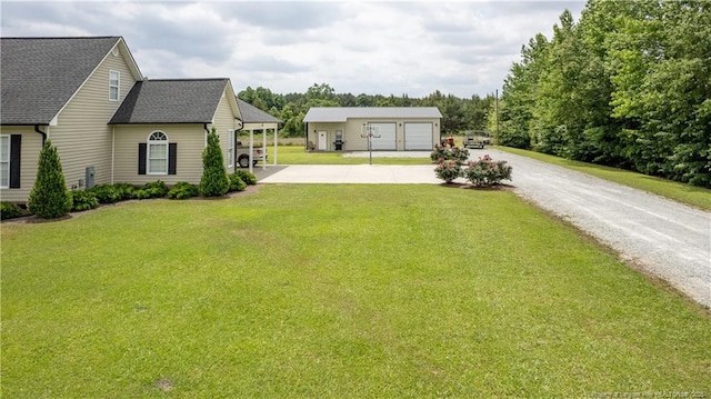 430 Rose Rd, Newton Grove, NC 28366 - view of grassy yard with driveway, an outdoor structure, and a garage