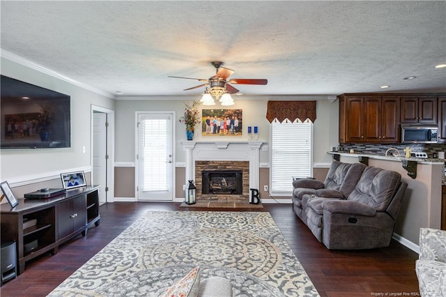 430 Rose Rd, Newton Grove, NC 28366 - living area featuring a ceiling fan, a textured ceiling, dark wood-style flooring, ornamental molding, and recessed lighting